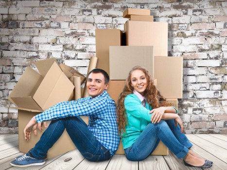 Packed moving boxes and furniture ready for transport