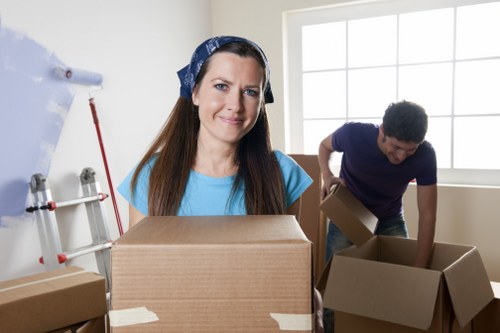 Packed boxes and furniture ready for a local house removal service