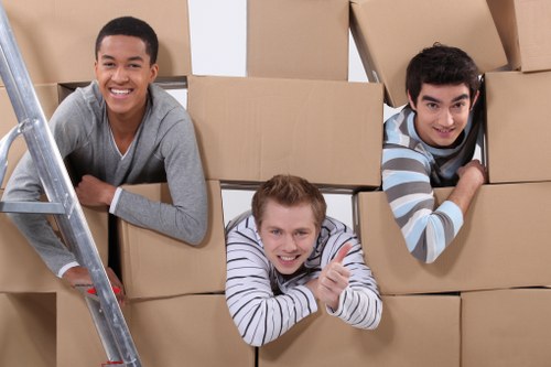 Local removal van helping with furniture and boxes in Crouch End
