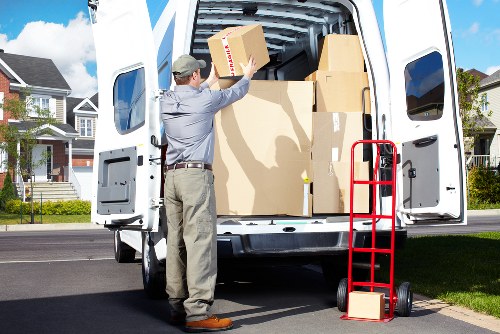 Local team loading a sofa and bedroom furniture for removal in Crouch End