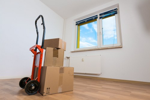 Organised boxes and wrapped furniture for a house removal in Crouchend