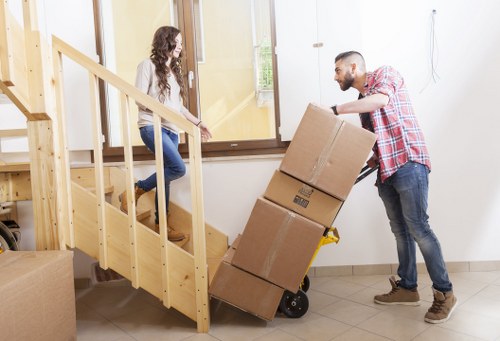 Removalists loading household items for a move in Crouch End