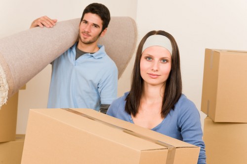 Loading furniture into a removal truck near Crouch End homes